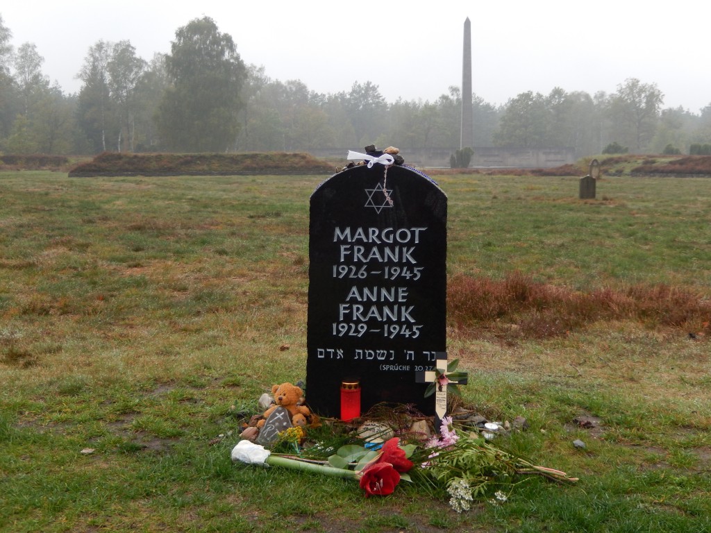 Headstone for the Frank sisters, memorial obelisk to the right, mass graves to the left and far right.